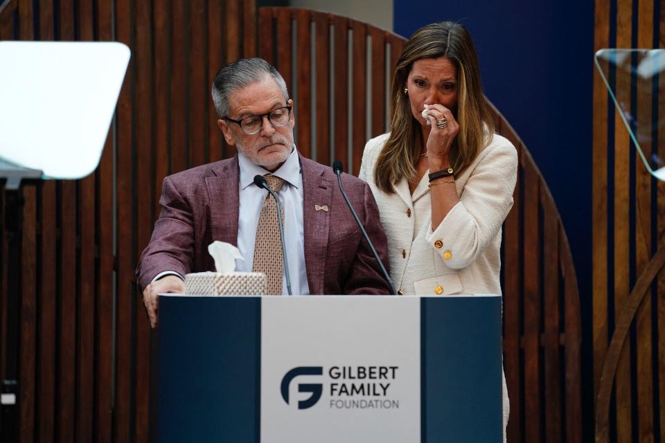 Dan and Jennifer Gilbert show emotion as they watch a video honoring their son, Nick Gilbert, who suffered from neurofibromatosis, a genetic disorder that causes tumors to grow on nerve pathways anywhere in the body, and died this year. Dan and Jennifer Gilbert announced a $375 million donation toward a physical medicine and rehabilitation facility as part of Henry Ford Health's campus expansion, and the Nick Gilbert Neurofibromatosis Research Institute on Wednesday, Sept. 6, 2023, in Detroit.