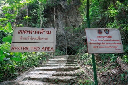 The cave entrance is seen during a ceremony for members of the Wild Boars soccer team, during their return to the Tham Luang caves where they were trapped in a year ago, in Chiang Rai