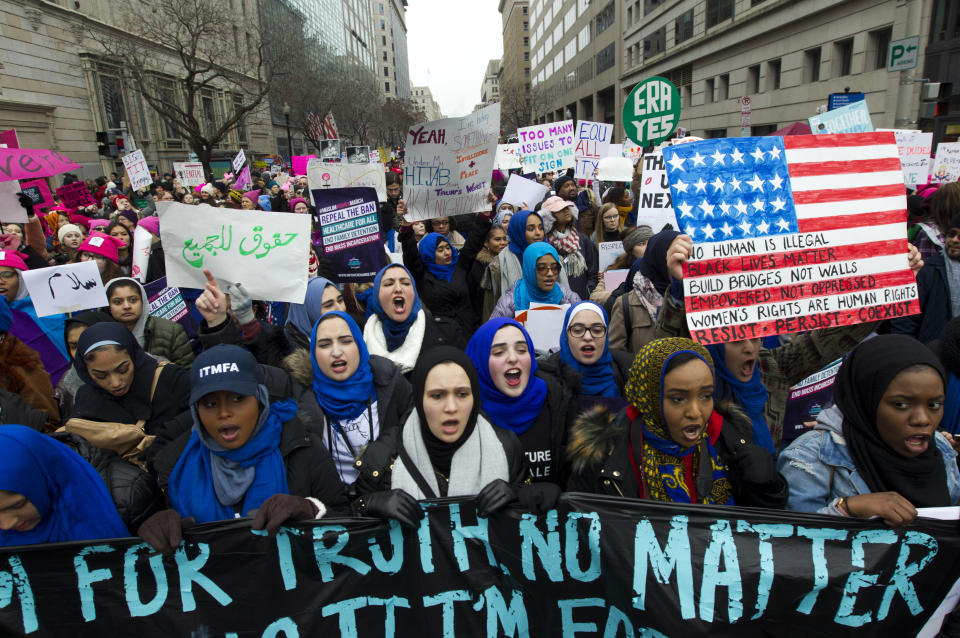 Demonstrators hold signs during the Women’s March in Washington on Saturday, Jan. 19, 2019. (Photo: Jose Luis Magana/AP)