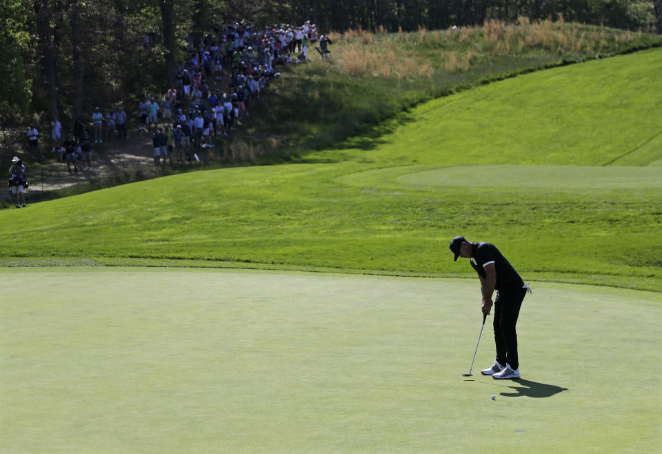 Brooks Koepka putts on the sixth green during the third round of the PGA Championship golf tournament, Saturday, May 18, 2019, at Bethpage Black in Farmingdale, N.Y. (AP Photo/Seth Wenig)