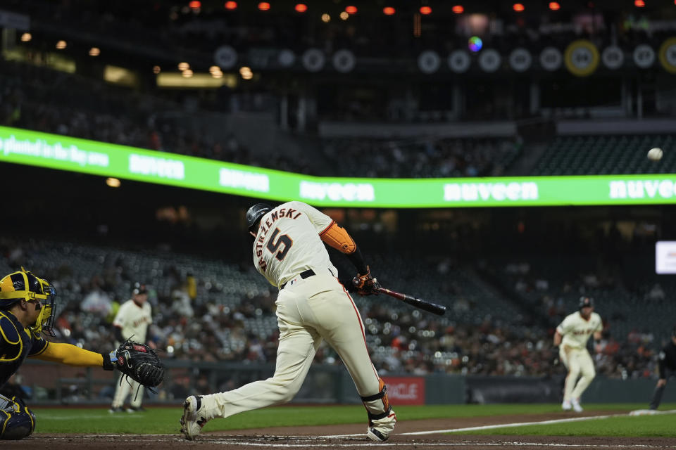 San Francisco Giants' Mike Yastrzemski (5) hits a three-run home run during the second inning of a baseball game against the Milwaukee Brewers, Wednesday, Sept. 11, 2024, in San Francisco. (AP Photo/Godofredo A. Vásquez)