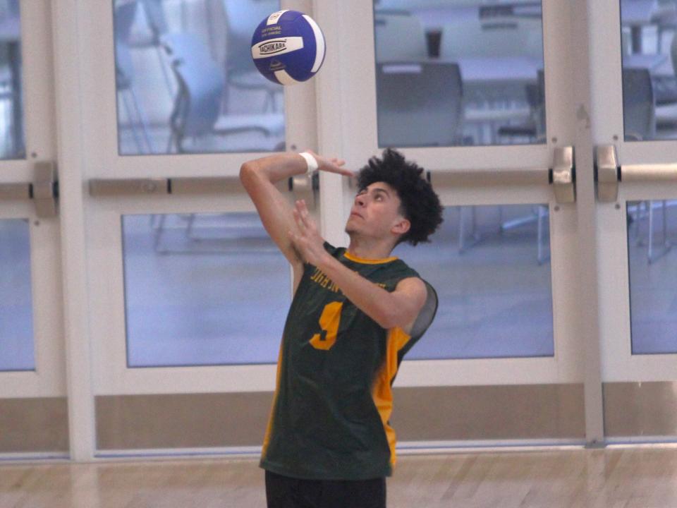 Dighton-Rehoboth's Yasiel Rodriguez serves during a non-league match against Attleboro.