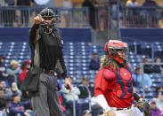 Home plate umpire Dean Poncsak, left, makes a strike call during the RailRiders-WooSox game Tuesday, April 25, 2023, at Polar Park in Worcester, Mass. Automatic balls and strikes could soon be coming to the major leagues. Disappearing with that are the complaints that an umpire's strike zone was too wide or a pitcher was getting squeezed, followed by the helmet-slamming, dirt-kicking dustups that are practically as old as the sport itself. (Katie Morrison-O'Day/MassLive via AP)