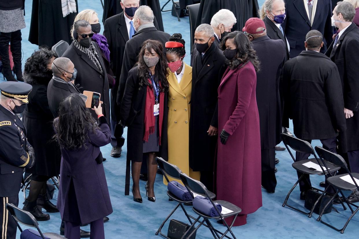 Poet Amanda Gorman (center) with former President Barack Obama and Michelle Obama on Jan. 20. (Photo: Pool via Getty Images)