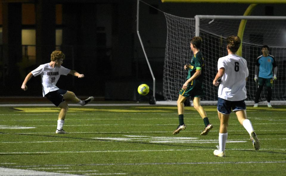 Benjamin's Ford Cash fires the ball into the box during a regular season game against Jupiter on Jan. 16, 2024.