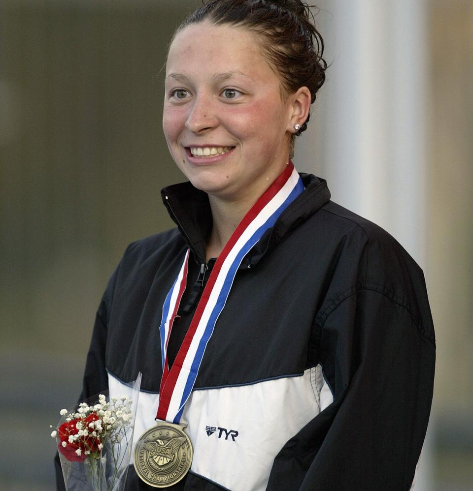 Kukors with her medal after winning&nbsp;the 200-meter individual medley at the ConocoPhillips National Championship on Aug. 7, 2005, around the time she says Hutchison began abusing her. (Photo: Todd Warshaw via Getty Images)