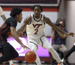 Miami's Nijel Pack (24) is defended by Virginia Tech's MJ Collins (2) in the first half of an NCAA college basketball game Saturday, Jan. 13, 2024, in Blacksburg, Va. (Matt Gentry/The Roanoke Times via AP)
