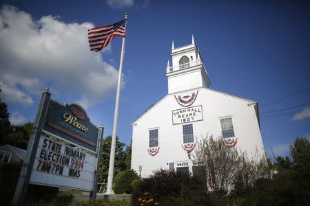 A sign reminds voters about the state's primary election in Weare, New Hampshire September 8, 2014, one day before the primary election date. REUTERS/Brian Snyder
