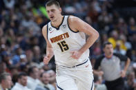 Denver Nuggets center Nikola Jokic heads back on defense during the second half of the team's NBA basketball game against the Memphis Grizzlies on Tuesday, Dec. 20, 2022, in Denver. (AP Photo/David Zalubowski)