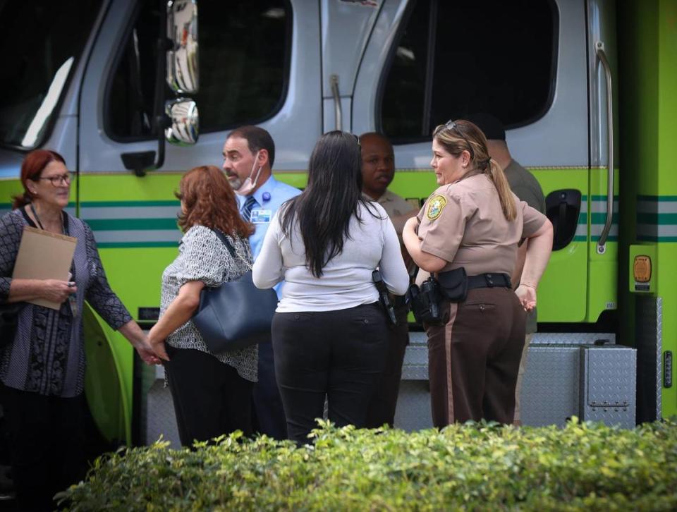 Multi-agency police officers gather outside the Ryder Trauma Center after one of their own was shot on Monday, Dec. 5, 2022.