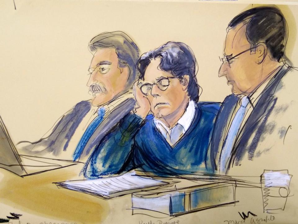 Keith Raniere, center, sits with attorneys Paul DerOhannesian, left, and Marc Agnifilo during closing arguments at Brooklyn federal court, Tuesday, June 18, 2019 in New York. 