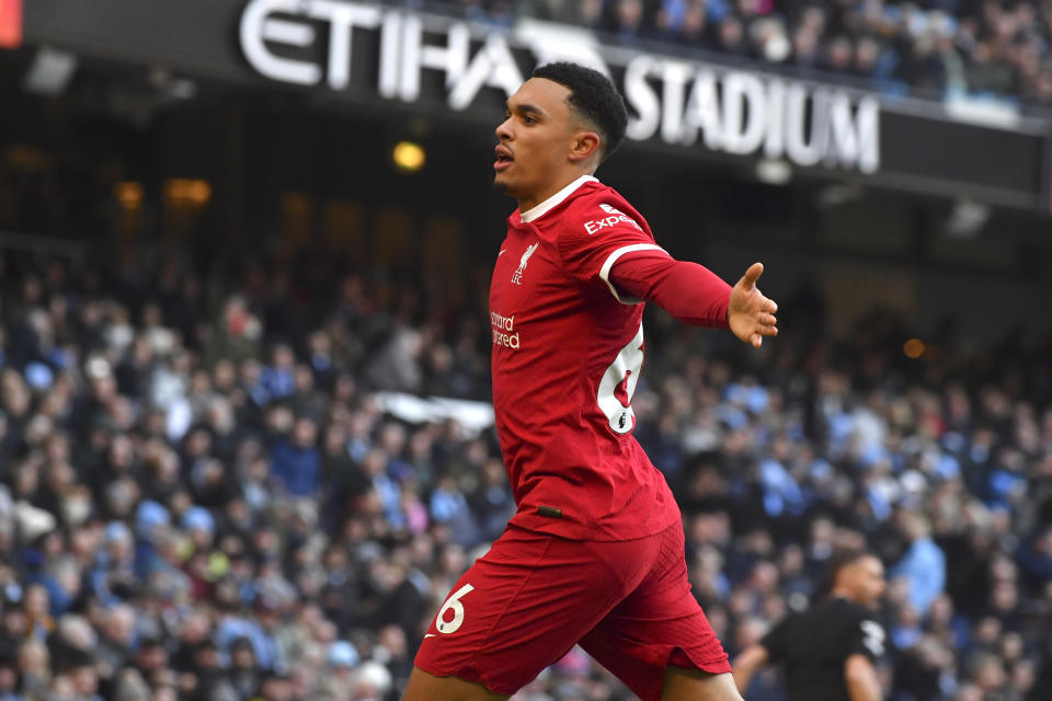 Liverpool's Trent Alexander-Arnold celebrates after scoring his side's opening goal during the English Premier League soccer match between Manchester City and Liverpool at Etihad stadium in Manchester, England, Saturday, Nov. 25, 2023. (AP Photo/Rui Vieira)