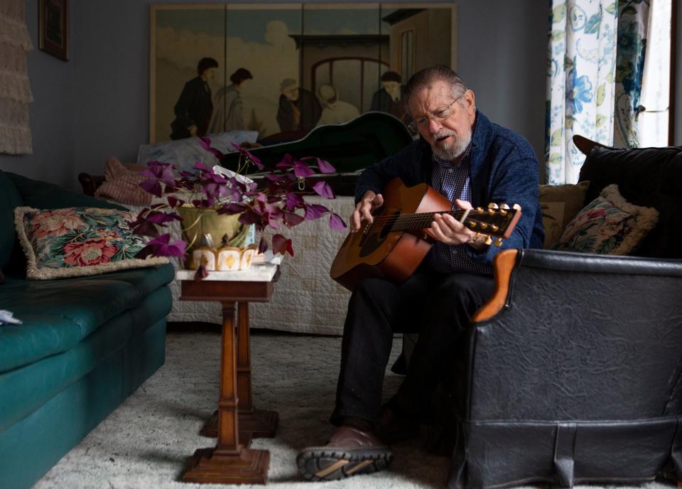 Bob Harvey, of Hideaway Hills, plays his guitar and sings his original song "Wadin in the Water" at his home in Hideaway Hills in Sugar Grove, Ohio on March 23, 2022. Harvey was the original bass guitar player for the band Jefferson Airplane.