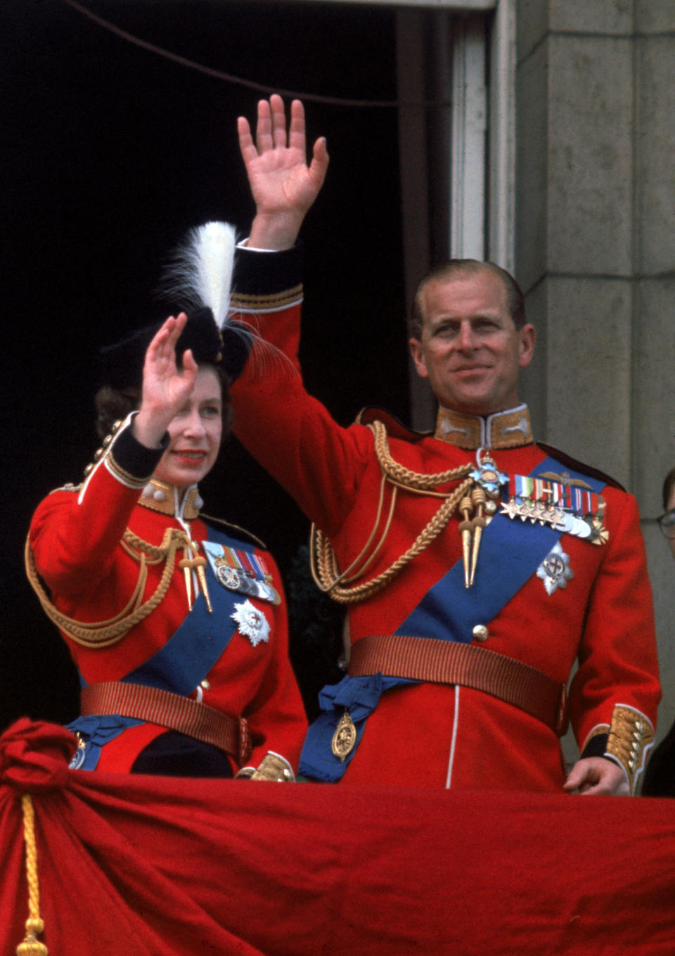 Waving from the balcony of Buckingham Palace during Trooping the Colour. [Photo: Getty]