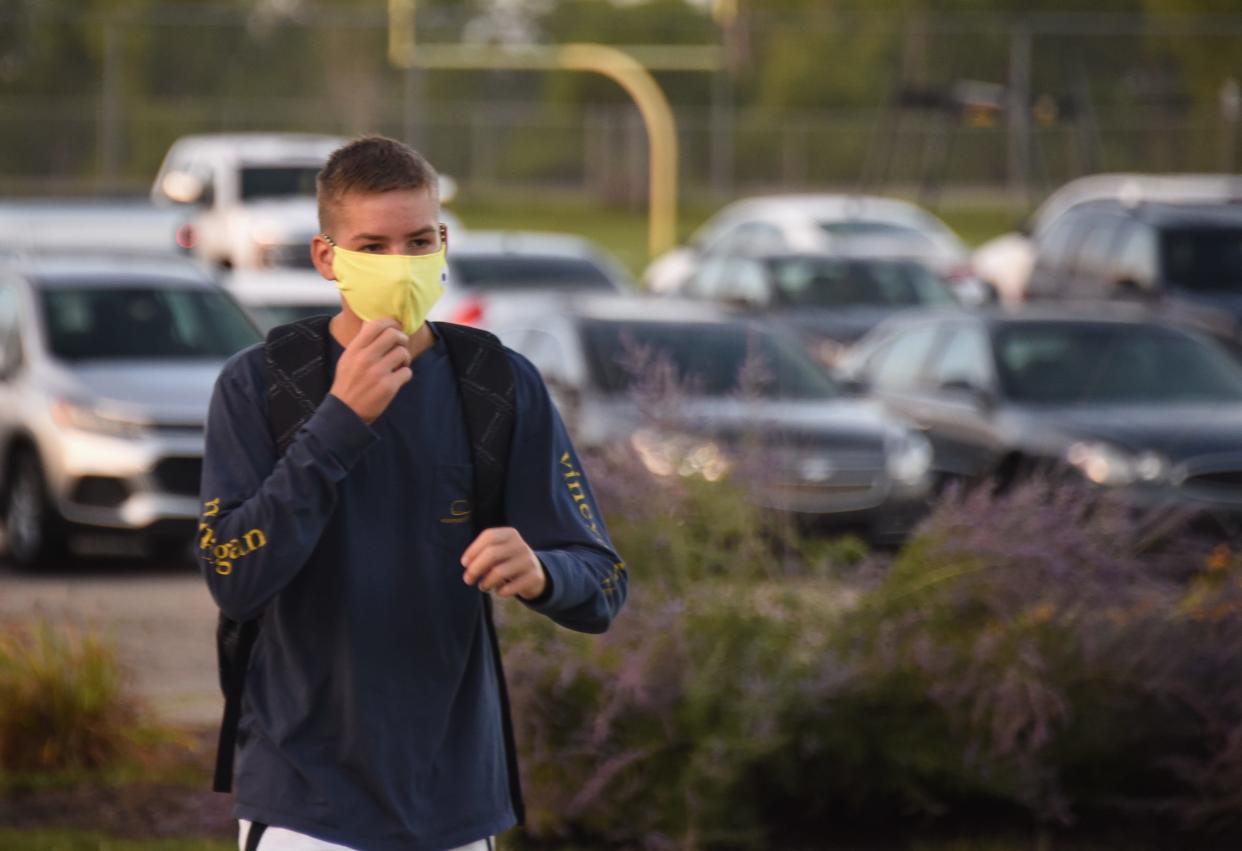 "I'm not that worried about COVID, what I'm worried about is wearing this mask all day," Mason sophomore Drew Perrault says on his way into Mason High School Wednesday morning, Aug. 25, 2021, for the first day of school.