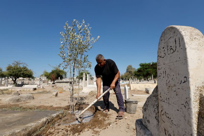 The Wider Image: Gaza struggles to accommodate the living and the dead as population grows