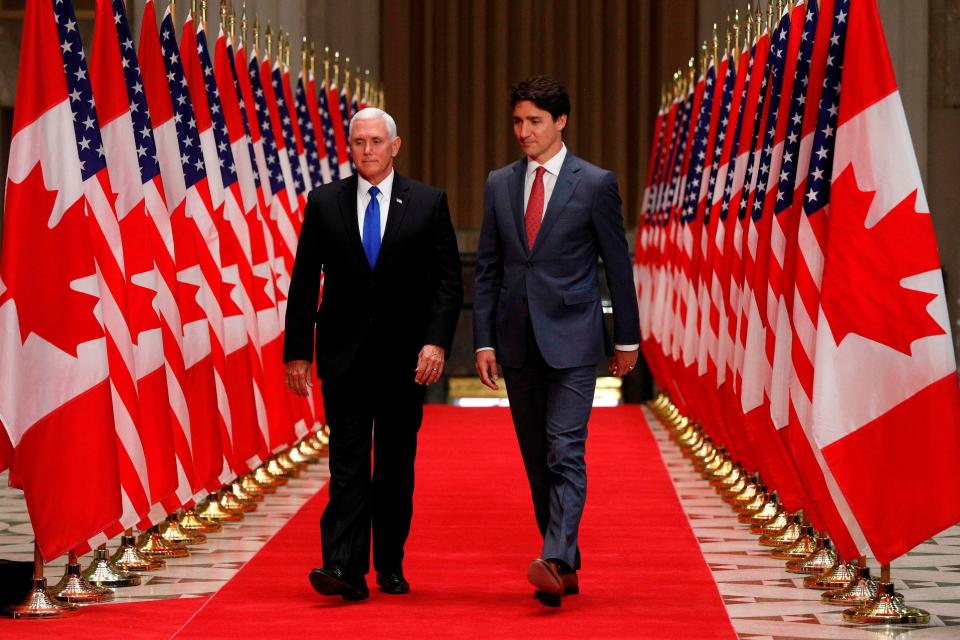 US Vice President Mike Pence (L) and Canadian Prime Minister Justin Trudeau arrive for a joint press conference in Ottawa, Ontario, on May 30, 2019.