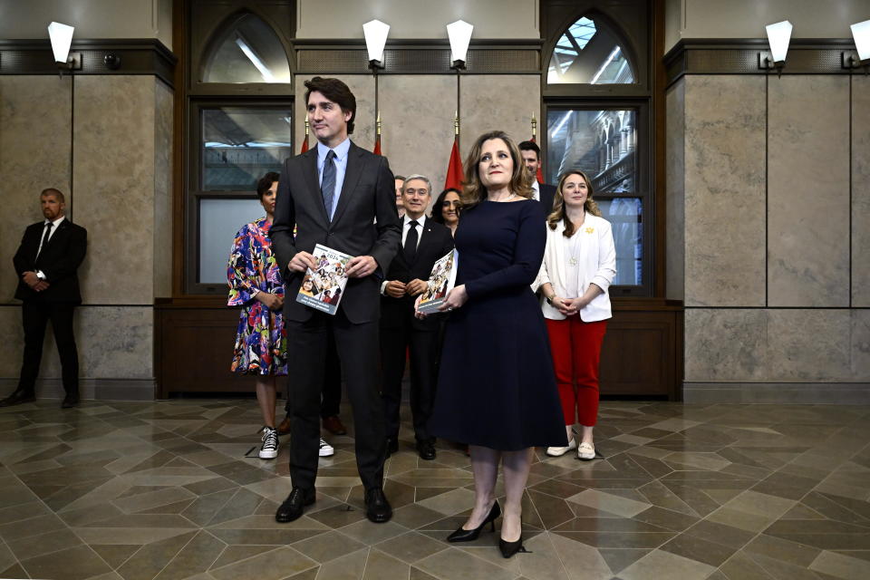 Canada's Prime Minister Justin Trudeau, left, Deputy Prime Minister, Minister of Finance Chrystia Freeland and cabinet ministers pose for a photo before the tabling of the federal budget on Parliament Hill in Ottawa, Ontario, on Tuesday, April 16, 2024. (Justin Tang/The Canadian Press via AP)