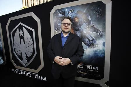 Director Guillermo del Toro poses at the premiere of "Pacific Rim" at Dolby theatre in Hollywood, California in this file photo taken July 9, 2013. REUTERS/Mario Anzuoni/Files