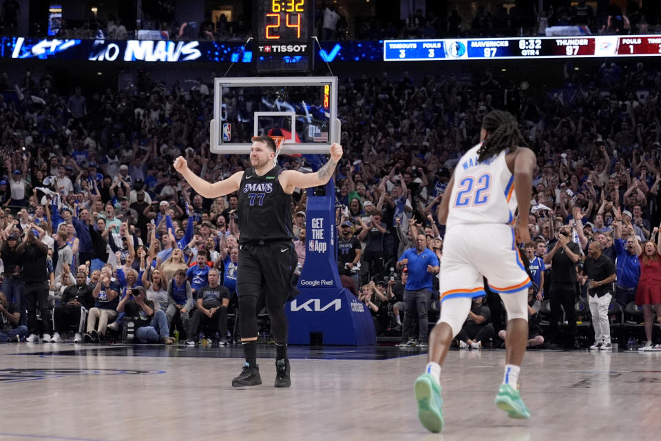 Dallas Mavericks' Luka Doncic (77) celebrates a basket in front of Oklahoma City Thunder's Cason Wallace (22) in the second half of Game 6 of an NBA basketball second-round playoff series Saturday, May 18, 2024, in Dallas. (AP Photo/Tony Gutierrez)