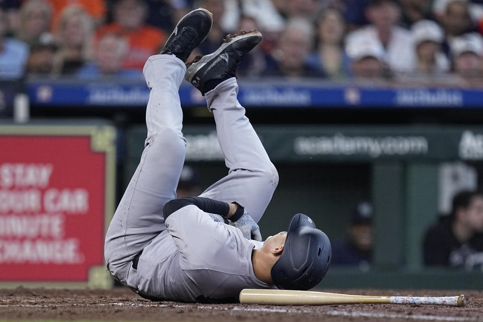 New York Yankees' Anthony Rizzo hits the ground after being hit by a pitch from Houston Astros starting pitcher Framber Valdez during the fifth inning of a baseball game, Thursday, March 28, 2024, in Houston. (AP Photo/Kevin M. Cox)