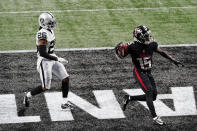 Atlanta Falcons wide receiver Brandon Powell (15) scores a touchdown aginst Las Vegas Raiders cornerback Nevin Lawson (26) during the second half of an NFL football game, Sunday, Nov. 29, 2020, in Atlanta. (AP Photo/Brynn Anderson)