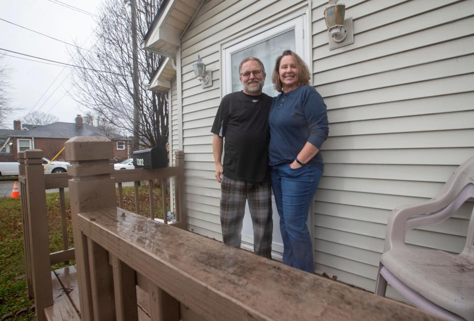 Bob Estes and his wife Andrea Estes outside an Emerson Avenue home that might be the model for the original one in the first Indianapolis Home Show in 1922. 