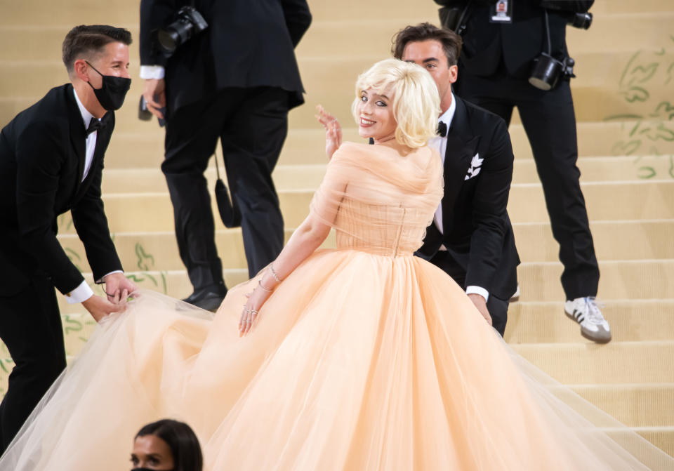 In a flared gown and blonde wig, à la Marilyn Monroe, at the Met Gala