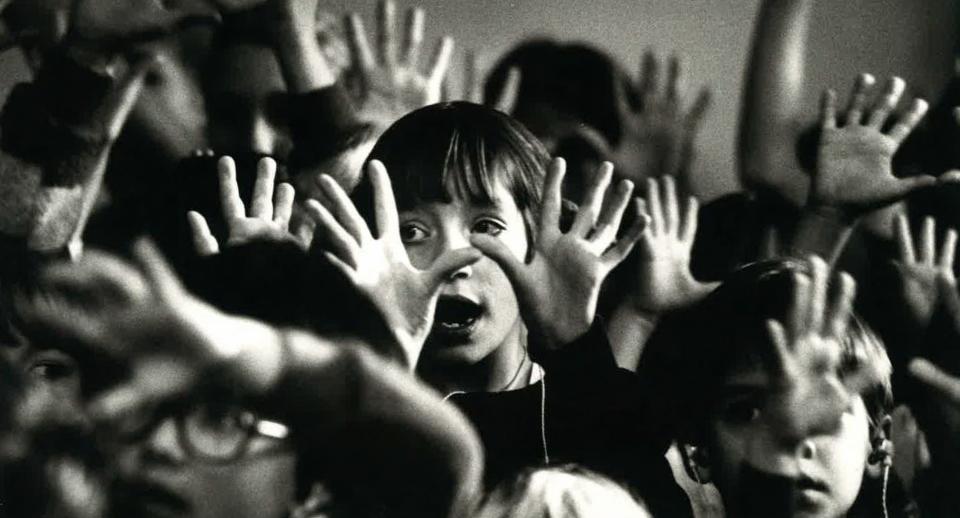 Deaf and hard of hearing children sign a Christmas carol at the Regional School for the Deaf, now known as Calk Elementary, in 1980.