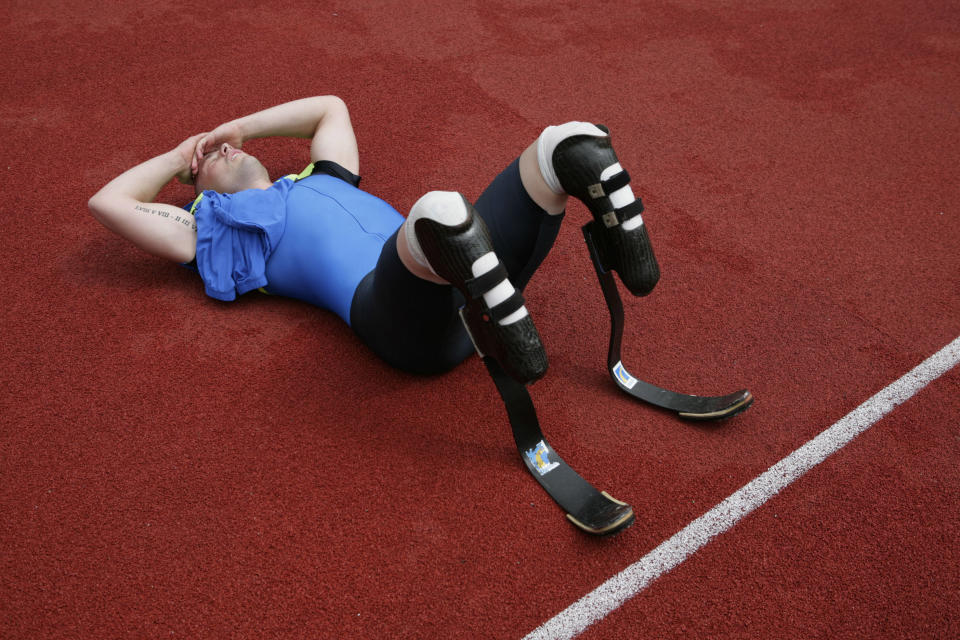 FILE In this Sunday June 1, 2008 file photos double-amputee sprinter Oscar Pistorius catches his breath after competing in the 400 meters of the Dutch Open Paralympics event in Emmeloord, Netherlands. With his athletic triumphs tarnished by the killing of his girlfriend, Reeva Steenkamp. Pistorius, now 27, faces possibly being sent to prison until he is older than 50. Pistorius goes on trial Monday March 3, 2014. (AP Photo/Peter Dejong-File)