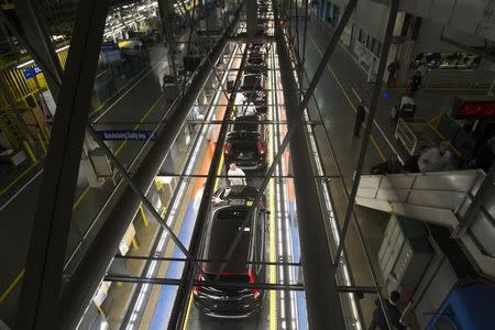 Production Associates inspect cars moving along assembly line at Honda manufacturing plant in Alliston, Ontario March 30, 2015. REUTERS/Fred Thornhill