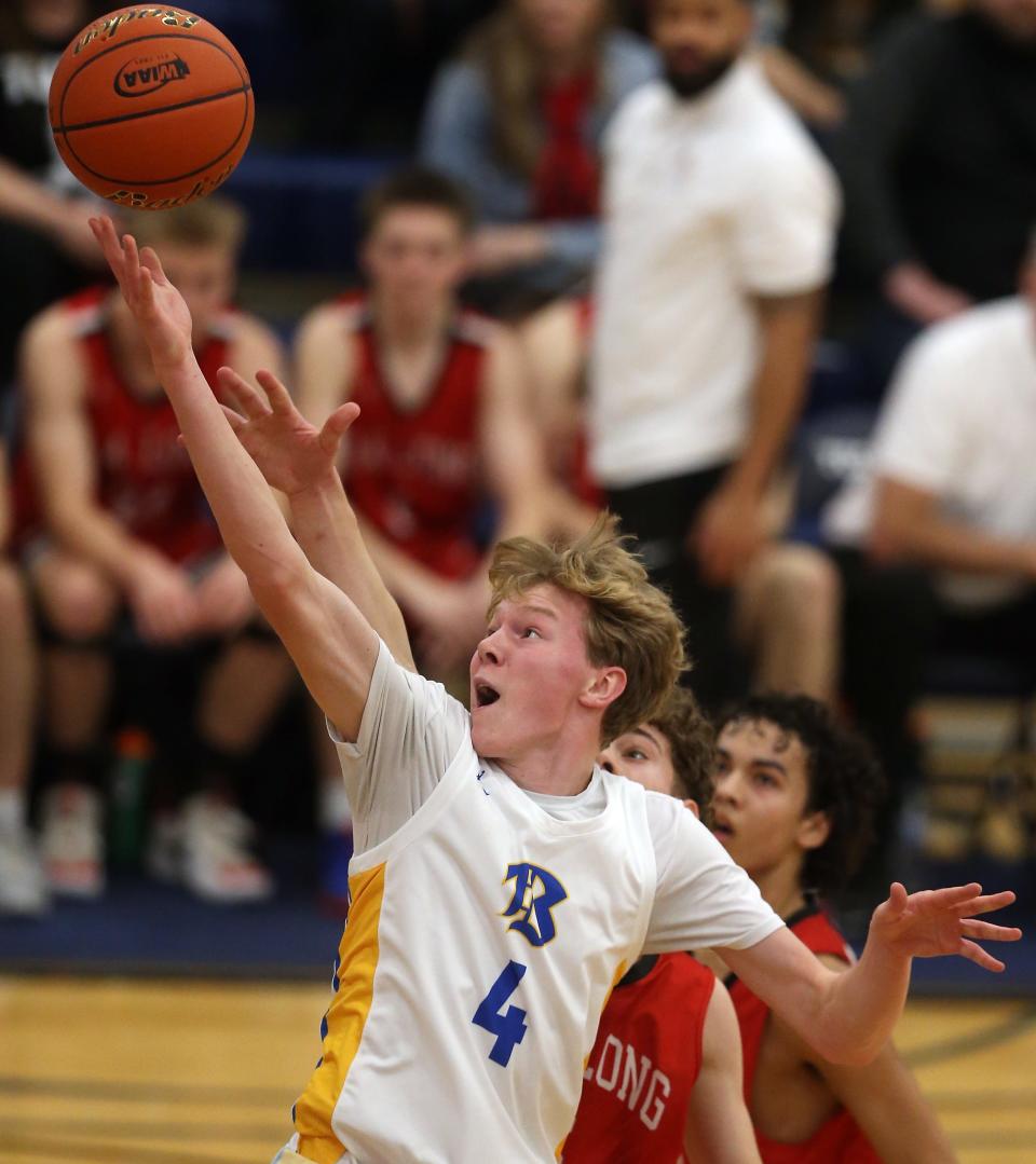 Bremerton’s Dallin Anderson (4) goes up for a layup during their 51-43 win over R.A. Long at Tacoma Community College on Saturday, Feb. 24, 2024.