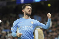 Manchester City's Bernardo Silva celebrates after scoring his side's fourth goal during the Champions League semi final, first leg soccer match between Manchester City and Real Madrid at the Etihad stadium in Manchester, England, Tuesday, April 26, 2022. (AP Photo/Jon Super)