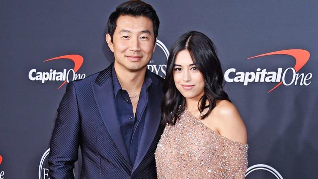 Simu Liu and girlfriend Jade Bender exchange a laugh on the red