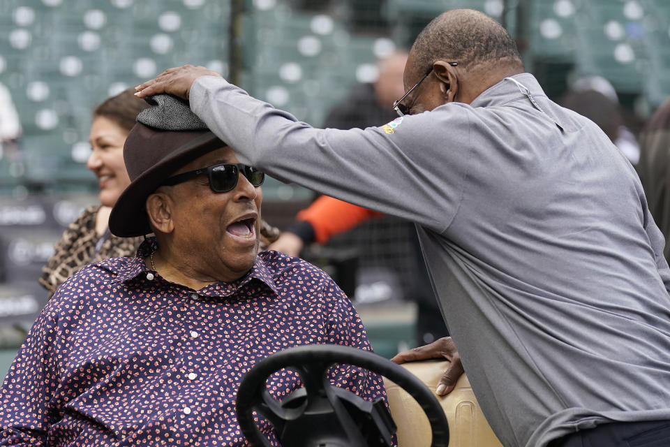 Hall of Fame player Orlando Cepeda, left, smiles as he talks with former San Francisco Giants player Tito Fuentes before a baseball game between the Giants and the Los Angeles Dodgers in San Francisco, Saturday, Sept. 17, 2022. (AP Photo/Jeff Chiu)