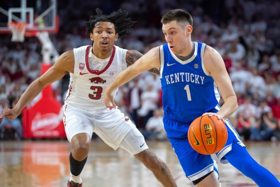 CJ Fredrick (1) drives the ball past Arkansas’ Nick Smith Jr. during Kentucky’s game at Bud Walton Arena in Fayetteville on March 4.