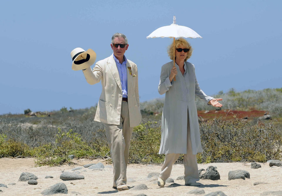 TOPSHOT - Britain's Prince Charles (L) walks with his wife Camilla Parker Bowles, Duchess of Cornwall, during a visit to Seymour island on March 17, 2009. The British royals are in a three-day visit to the Ecuadorean Galapagos island. AFP PHOTO/Rodrigo Buendia (Photo by Rodrigo BUENDIA / AFP) (Photo by RODRIGO BUENDIA/AFP via Getty Images)