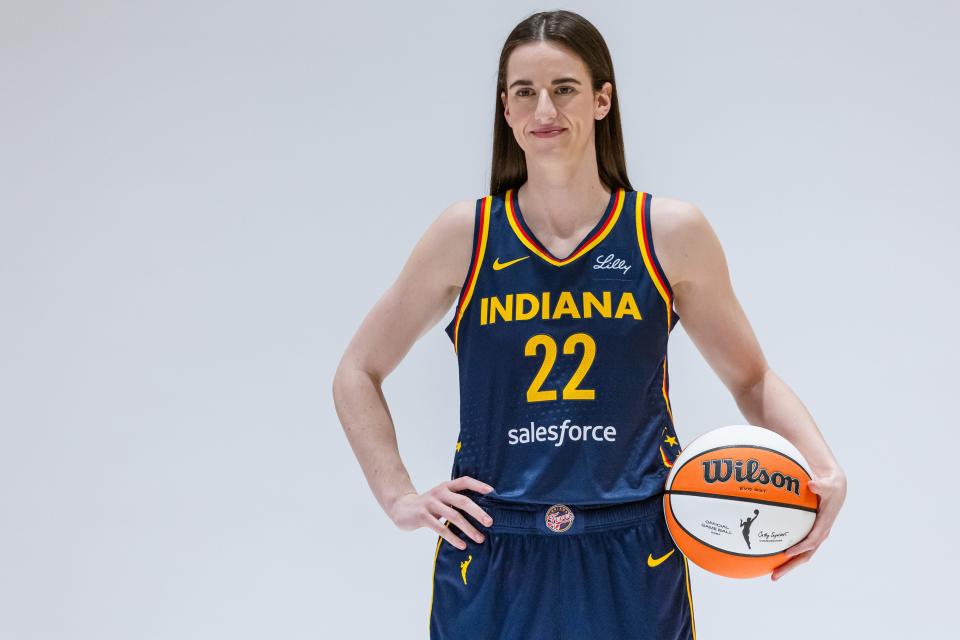 INDIANAPOLIS, INDIANA - MAY 1: Caitlin Clark #22 of the Indiana Fever poses for photographers during media day activities at Gainbridge Fieldhouse on May 1, 2024 in Indianapolis, Indiana. NOTE TO USER: User expressly acknowledges and agrees that, by downloading and or using this photograph, User is consenting to the terms and conditions of the Getty Images License Agreement. (Photo by Michael Hickey/Getty Images)