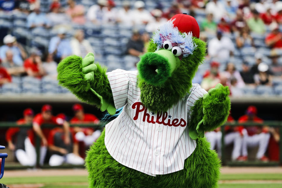 FILE - In this Feb. 25, 2020, file photo, The Phillie Phanatic mascot performs before a spring training baseball game against the Toronto Blue Jays in Clearwater, Fla. Mascots have no other place in baseball should the sport resume. Mascots will be banned. Take a look across the globe and mascots remained a staple of baseball games in Taiwan and the KBO League in South Korea. (AP Photo/Frank Franklin II, File)