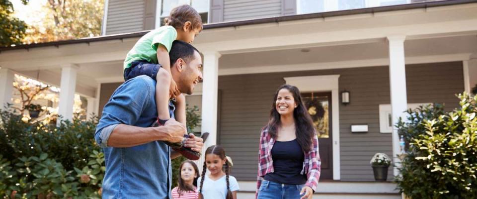 Father Gives Son Ride On Shoulders As Family Leave House