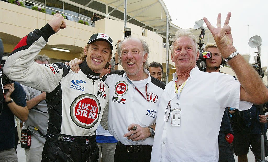 sakhir, bahrain april 4 jenson button of great britain and bar celebrates with his father john and bar boss dave richards after finishing 3rd during the bahrain f1 grand prix at the bahrain racing circuit on april 4, 2004 in sakhir, bahrain photo by clive masongetty images