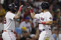 Boston Red Sox's Christian Arroyo, right, celebrates with Alex Verdugo after his two-run home run during the second inning of a baseball game, Tuesday, Aug. 9, 2022, in Boston. (AP Photo/Charles Krupa)