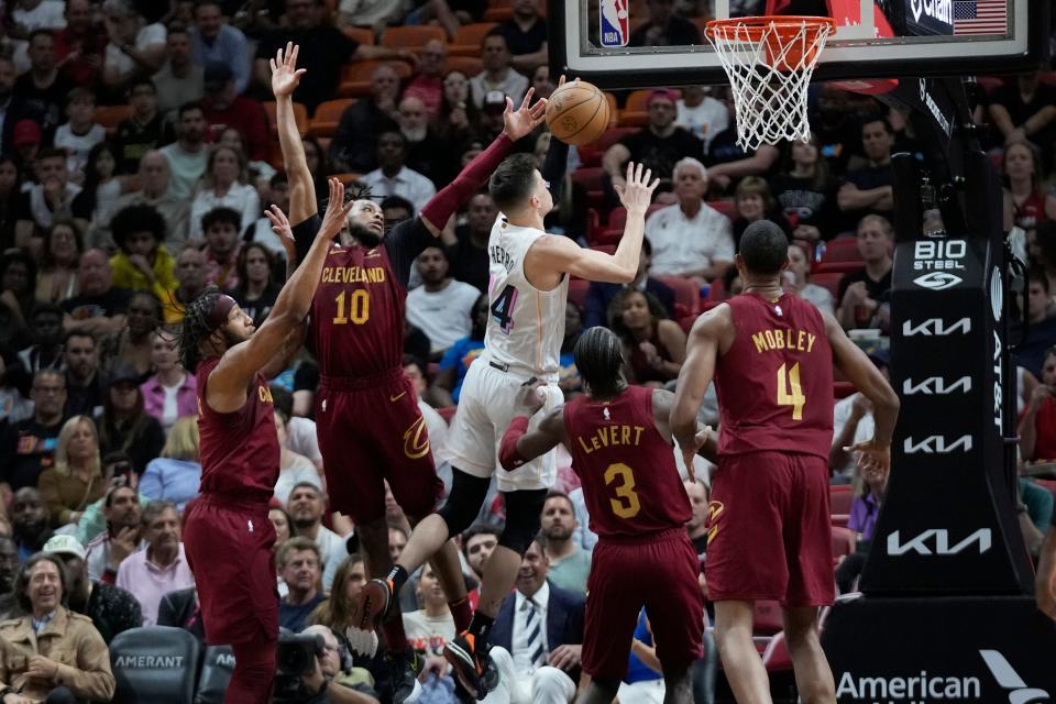 Miami Heat guard Tyler Herro (14) goes up for a shot during the first half of an NBA basketball game against the Cleveland Cavaliers, Wednesday, March 8, 2023, in Miami. (AP Photo/Wilfredo Lee)