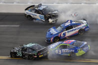 Noah Gragson (62), Kyle Larson (5), Todd Gilliland (38) and Erik Jones (43) crash during the NASCAR Daytona 500 auto race Sunday, Feb. 20, 2022, at Daytona International Speedway in Daytona Beach, Fla. (AP Photo/Chris O'Meara)