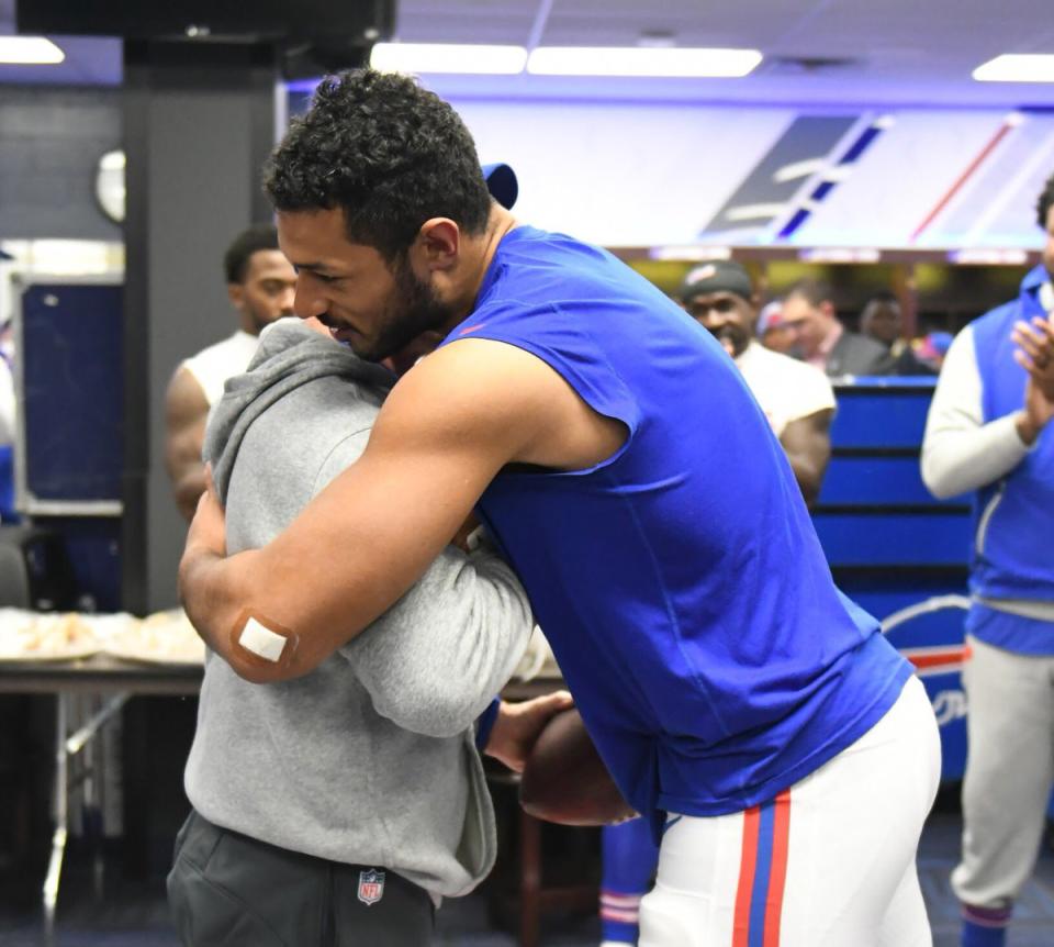 Buffalo TE Logan Thomas and coach Sean McDermott embrace after Thomas is given a game ball. Thomas’ baby was born prematurely and died this week. (Bills Twitter)