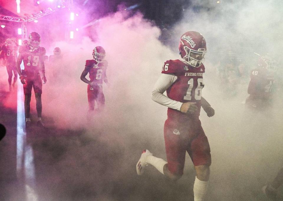 Fresno State players enter the field for their game with New Mexico at Bulldog Stadium on Saturday, Nov. 18, 2023.