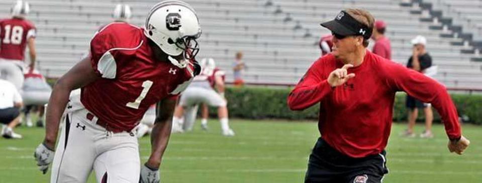 South Carolina WR Alshon Jeffery (1) is guarded by coach Steve Spurrier Jr. as he runs routes during the Gamecocks’ practice and scrimmage at Williams-Brice Stadium, Saturday, August 21, 2010.