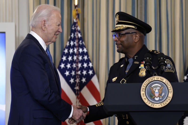 President Joe Biden greets Detroit police chief James White before delivering remarks on his actions to fight crime in the State Dining Room at the White House in Washington, D.C., on Wednesday. Photo by Yuri Gripas/UPI