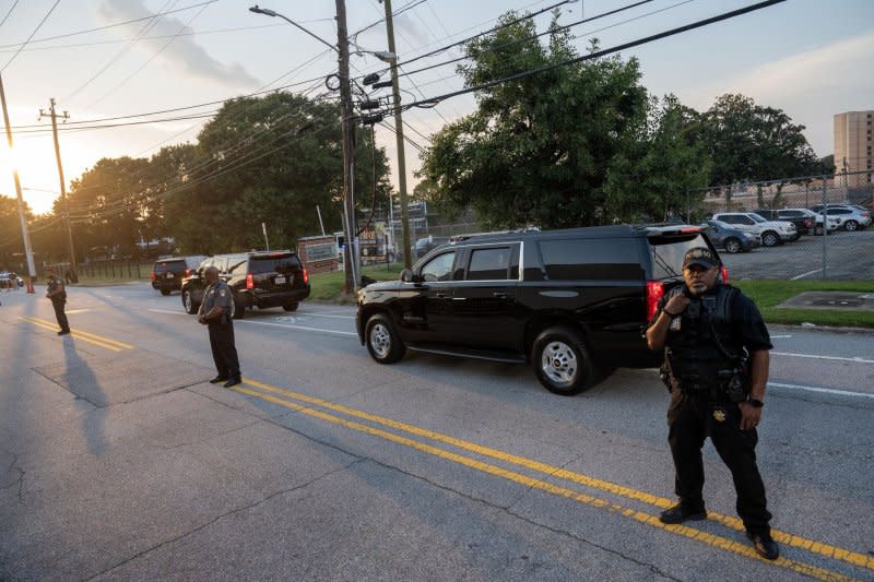 Former president Donald Trump's motorcade arrives at the Fulton County Jail intake center in Atlanta, Ga., on Thursday. The former president was processed in about 20 minutes at the jail, during which he agreed to a $200,000 bond. Photo by Anthony Stalcup/UPI