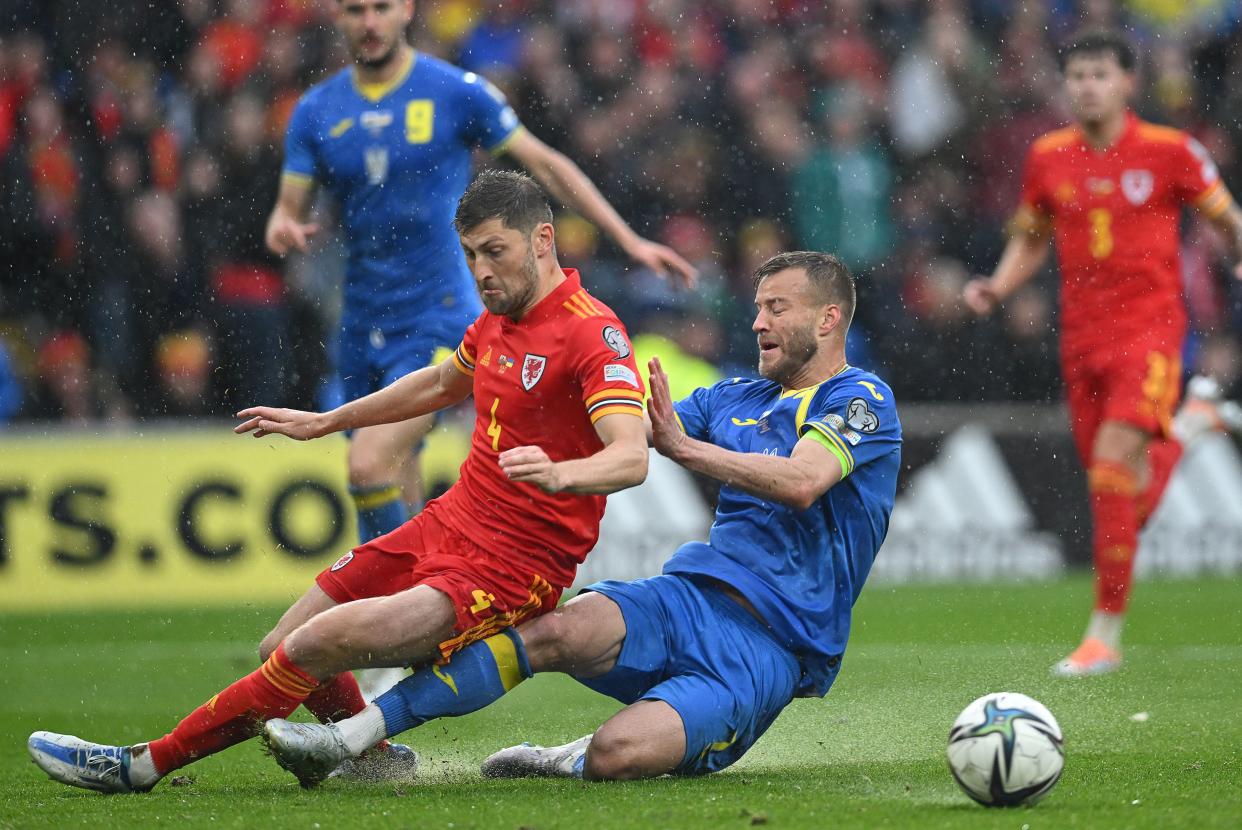 Andriy Yarmolenko (R), Ukraine's captain, scored the own goal that sent Wales to the World Cup. (Photo by PAUL ELLIS/AFP via Getty Images)